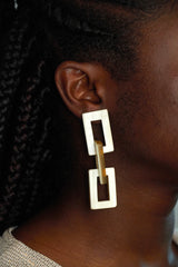 Payday Playday earrings make the perfect fun gift for a girlfriend, pictured here on the ear of a model
